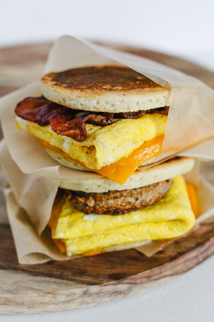 A bacon egg and cheese healthy McGriddle stacked on top of a sausage egg and cheese healthy McGriddle