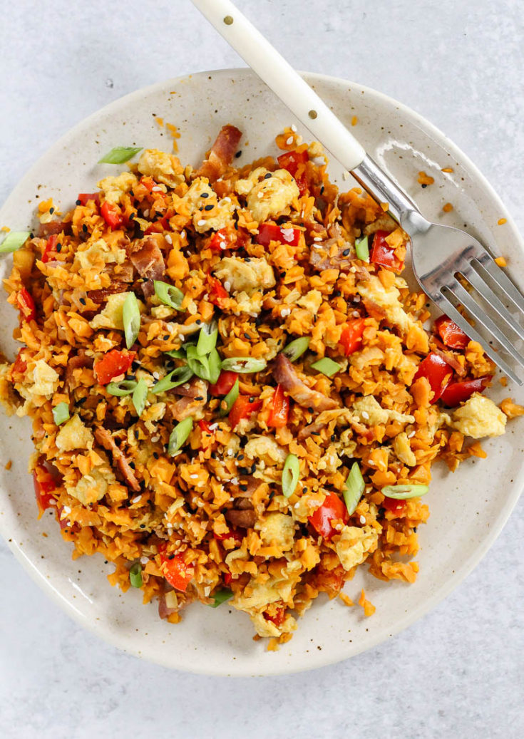 Breakfast fried sweet potato rice on a plate, birds eye view.