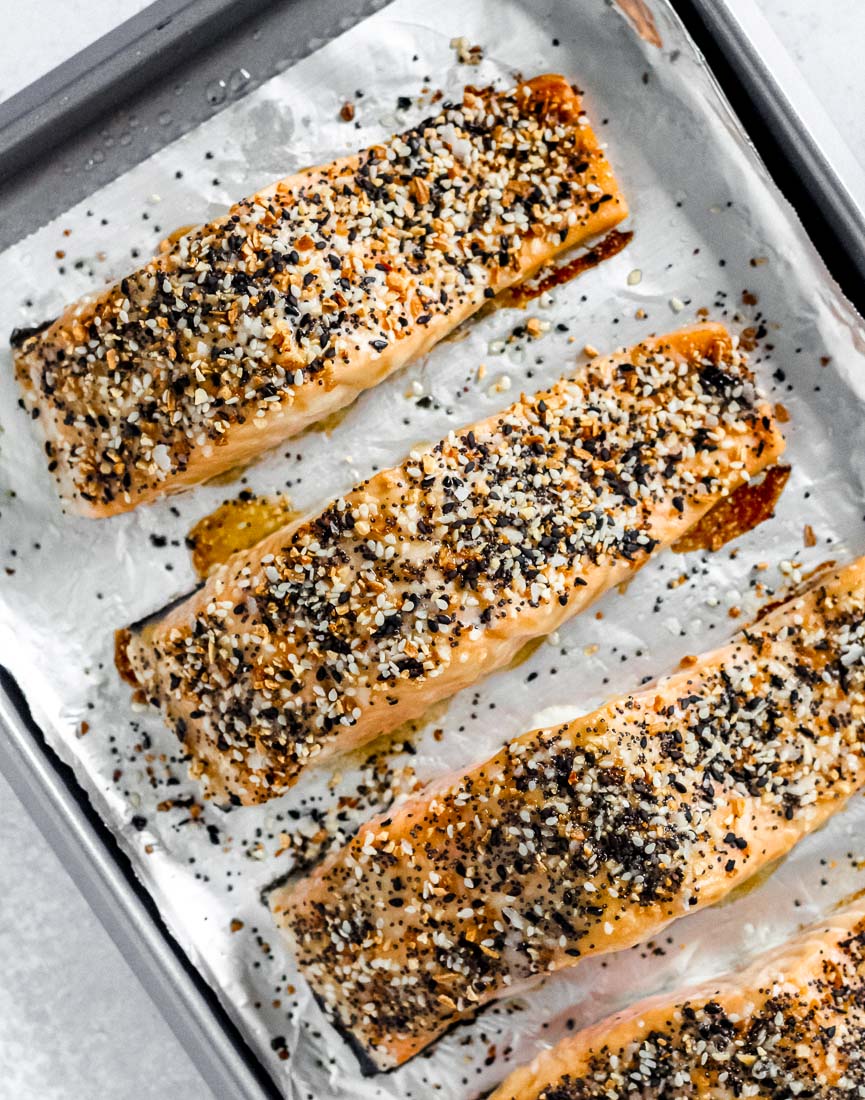 Everything bagel salmon on a foil-lined baking sheet.